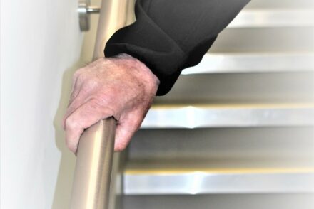 What are the ‘warm-to-touch’ guidelines for handrails?