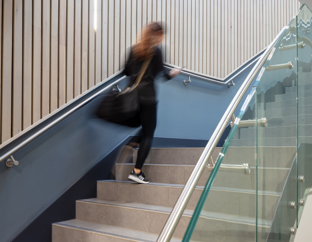 07 person walking up main stair 