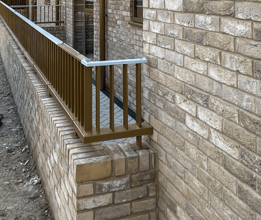 Vertical bar balustrade at ground level